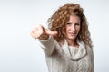 Young woman giving a thumb to side gesture Royalty Free Stock Photo