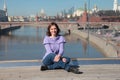 Young woman on a glass bridge on the background of the Moscow Kremlin Royalty Free Stock Photo