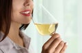 Young woman with glass of luxury white wine indoors, closeup Royalty Free Stock Photo