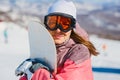 A young woman in glasses with orange ski snowboard Royalty Free Stock Photo