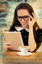 Young Woman with Glasses and Tablet Having Coffee Royalty Free Stock Photo