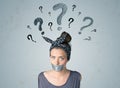 Young woman with glued mouth and question mark symbols Royalty Free Stock Photo