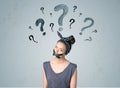 Young woman with glued mouth and question mark symbols Royalty Free Stock Photo