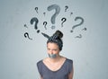 Young woman with glued mouth and question mark symbols Royalty Free Stock Photo