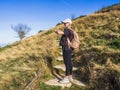 Young woman going up the stairs to the top of the mountain. The woman looking at her watch. Woman with a watch. Royalty Free Stock Photo