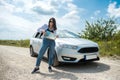 Young woman got lost and looking to a map for planning new trip Royalty Free Stock Photo