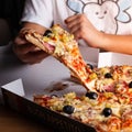 Young woman grabbing a slice of pizza