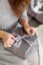 Young woman opens the box with a Christmas present Royalty Free Stock Photo