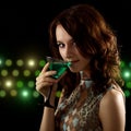 Young woman with a green cocktail Royalty Free Stock Photo