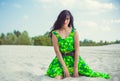 Young woman in green dress, lifestyle