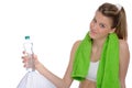 Young woman with green fitness towel