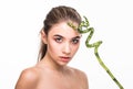 Young woman with green leaf, isolated on white. Beauty natural make up. Spa and wellness and skin care concept. Close up, selectiv Royalty Free Stock Photo