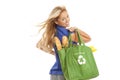 Young woman with green recycled grocery bag