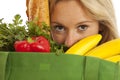 Young woman with green recycled grocery bag