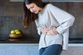 Sick female with stomachache. Health care concept Royalty Free Stock Photo