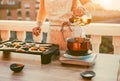 Young woman grill vegetables while preparing dinner in patio terrace outdoor - Food, healthy lifestyle and vegetarian concept - Royalty Free Stock Photo