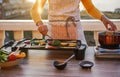 Young woman grill vegetables while preparing dinner in patio terrace outdoor during isolation quarantine - Food, healthy lifestyle Royalty Free Stock Photo