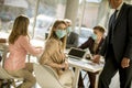 Young woman with group of business people have a meeting and working in office and wear mask as protection from corona virus Royalty Free Stock Photo