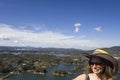 Young woman at Guatape lake in Antioquia, Colombia