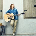 Young woman guitar playing on street. Royalty Free Stock Photo