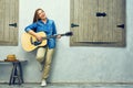 Young woman guitar playing on street. Royalty Free Stock Photo