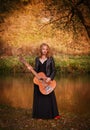 Young woman with guitar Royalty Free Stock Photo