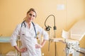 Young woman gynecologist standing behind an armchair