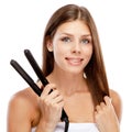 Young woman with a hair straightener