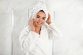 Young woman with hair wrapped in towel Royalty Free Stock Photo