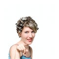 Young woman with haircurlers in her heir Royalty Free Stock Photo