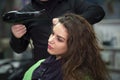 young woman in hairdresser salon drying hair Royalty Free Stock Photo