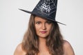 Young woman in Halloween witch hat with serious face Royalty Free Stock Photo