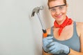 Young woman with hammer in hands Royalty Free Stock Photo