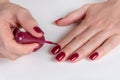 Effortless Elegance: Artful Nails Painted in Dark Red Polish Royalty Free Stock Photo