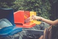 Young woman hand dropping plastic bottle into recycle bin. Royalty Free Stock Photo