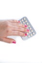Young woman hand holding a contraceptive pills blister Royalty Free Stock Photo