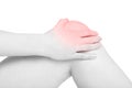 Young woman hand holding painful knee, red pain area