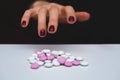 Young woman hand with pills. Overdose and suicide concep