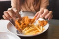 in young woman hand select focus, Hand with fried chicken blur background, Close-up Fried chicken Royalty Free Stock Photo