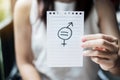 Young woman hand showing paper note with gender of LGBTQ symbol for Lesbian, Gay, Bisexual, Transgender and Queer community