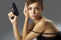 Young woman with handgun