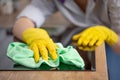 Young woman hands cleaning a modern black induction hob by a rag, housework Royalty Free Stock Photo