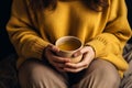 Young woman hands holding aromatic teacup cup of green leaves tea hot steaming beverage morning comfy comfortable Royalty Free Stock Photo