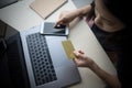 Young woman hands holding credit card using laptop computer and mobile smart phone Online shopping Royalty Free Stock Photo