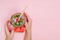 Young woman hands holding freshly squeezed watermelon lemonade of citrus fruits. Female with mason jar full of cold cocktail, mint Royalty Free Stock Photo