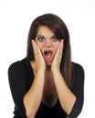 Young woman with hands holding her face surprised Royalty Free Stock Photo
