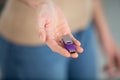 young woman hands holding purple flash drive Royalty Free Stock Photo