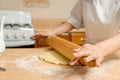 Young woman hands rolling dough Royalty Free Stock Photo