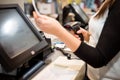 Young woman hands scaning, entering discount, sale on a receipt, touchscreen cash register, POS, finance concept Royalty Free Stock Photo