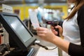Young woman hands scaning, entering discount, sale on a receipt, touchscreen cash register, POS, finance concept